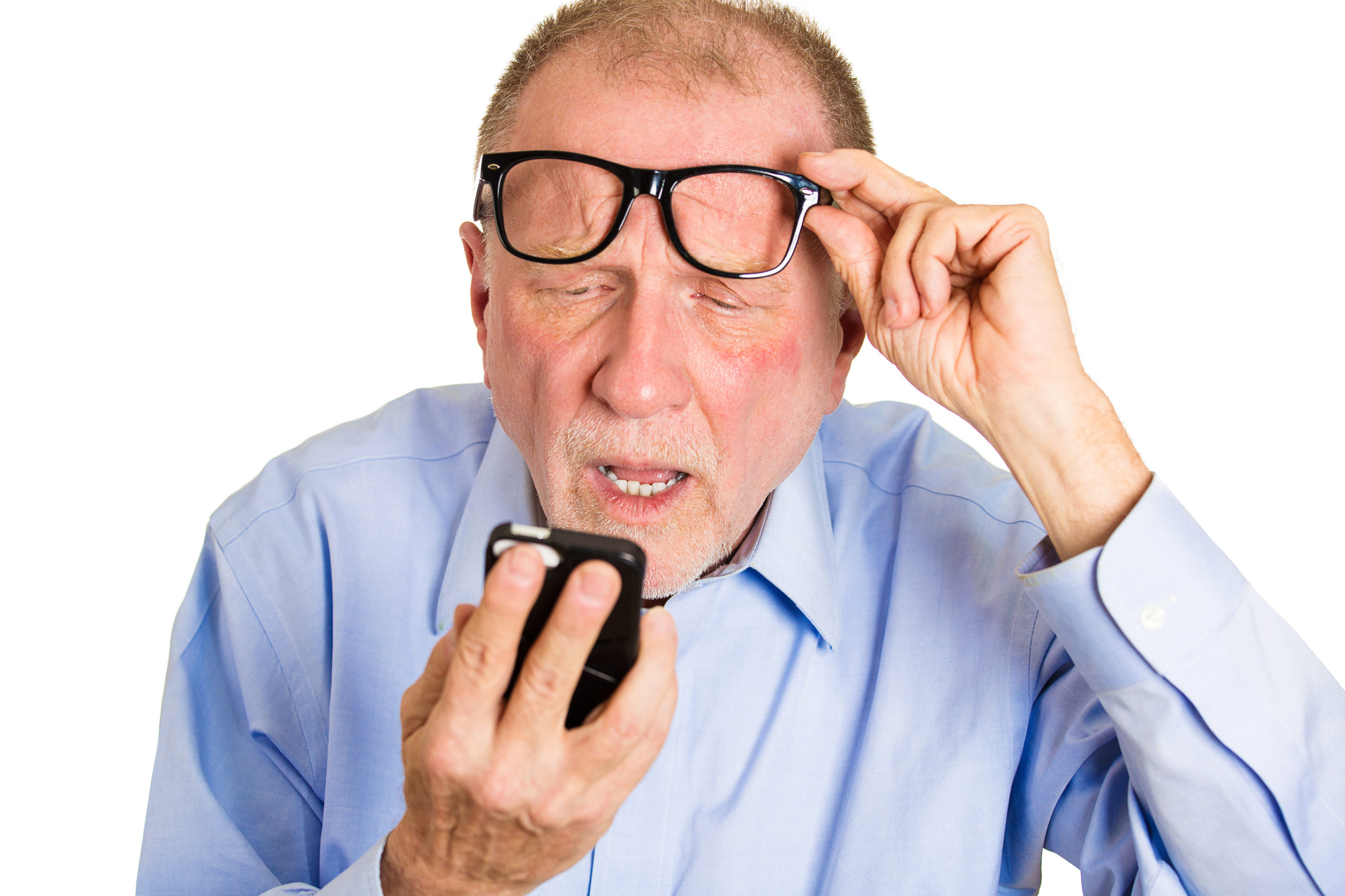 senior man squinting at phone