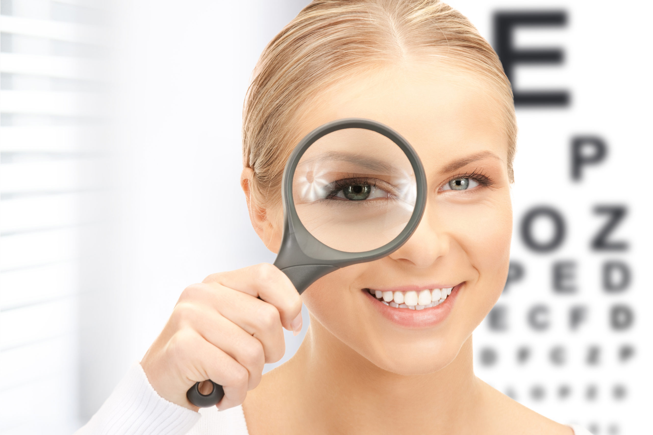 woman with clear vision using magnifying glass