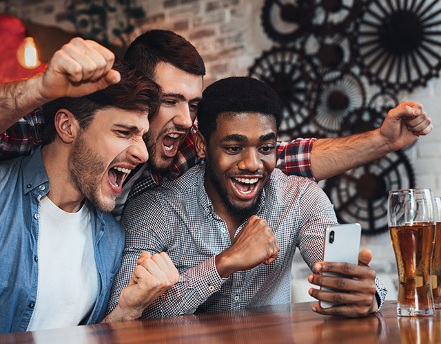Corneal conditions patient with group of guy friends cheering
