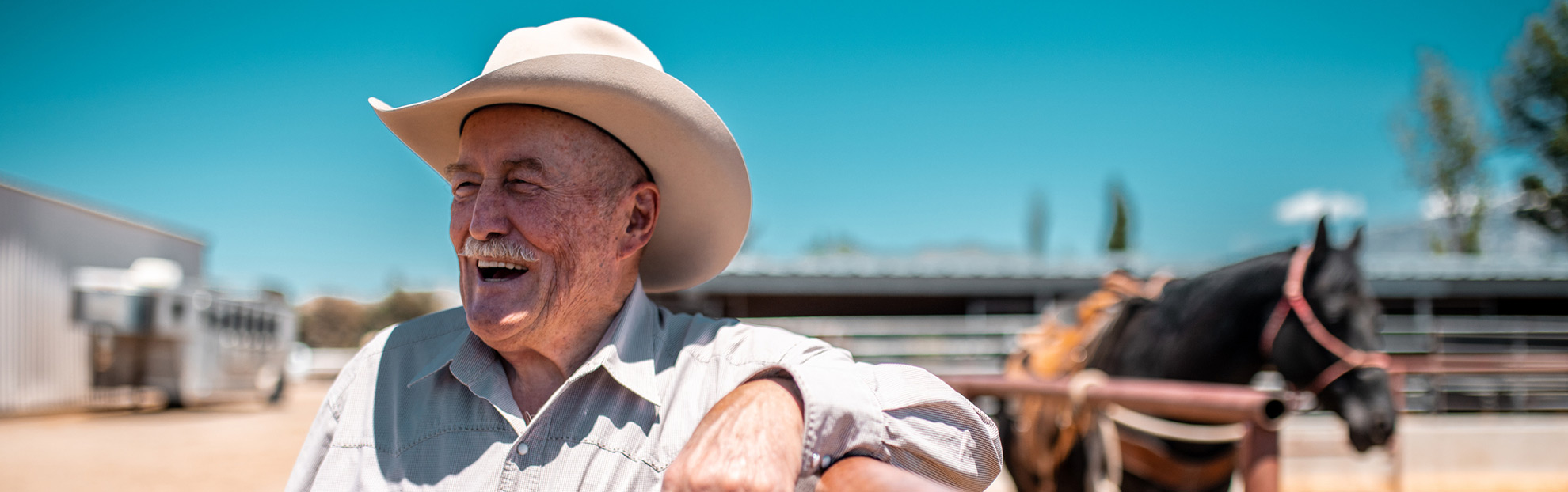 Arizona glaucoma eye care patient smiling and happy on his ranch