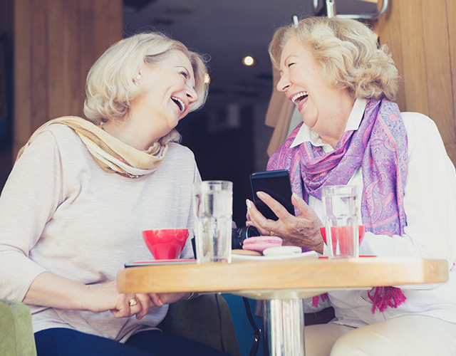 Older ladies enjoying lunch together: eye care patients