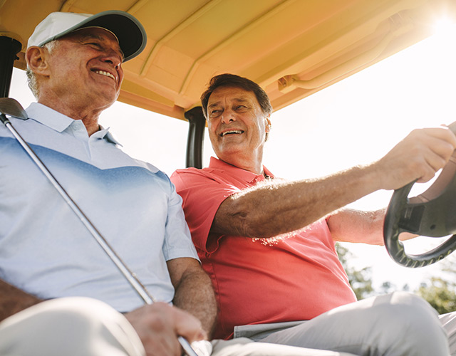 Cataract surgery patients playing golf, enjoying clearer vision
