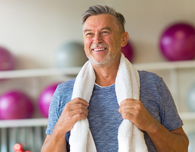 Happy cataract surgery patient in exercise room