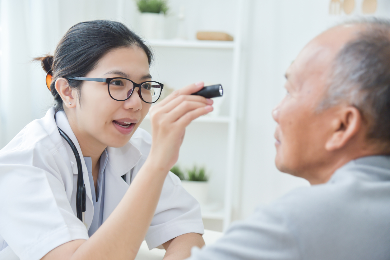 doctor examining patient's eye